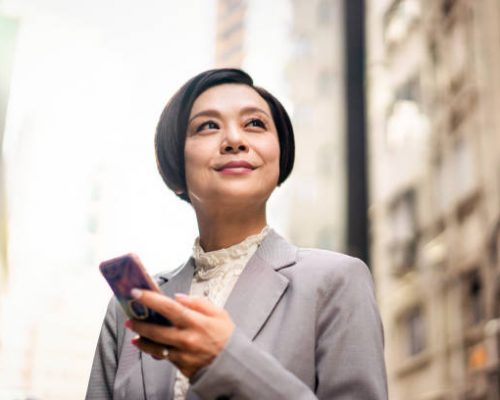 Smiling Chinese businesswoman in Hong Kong.